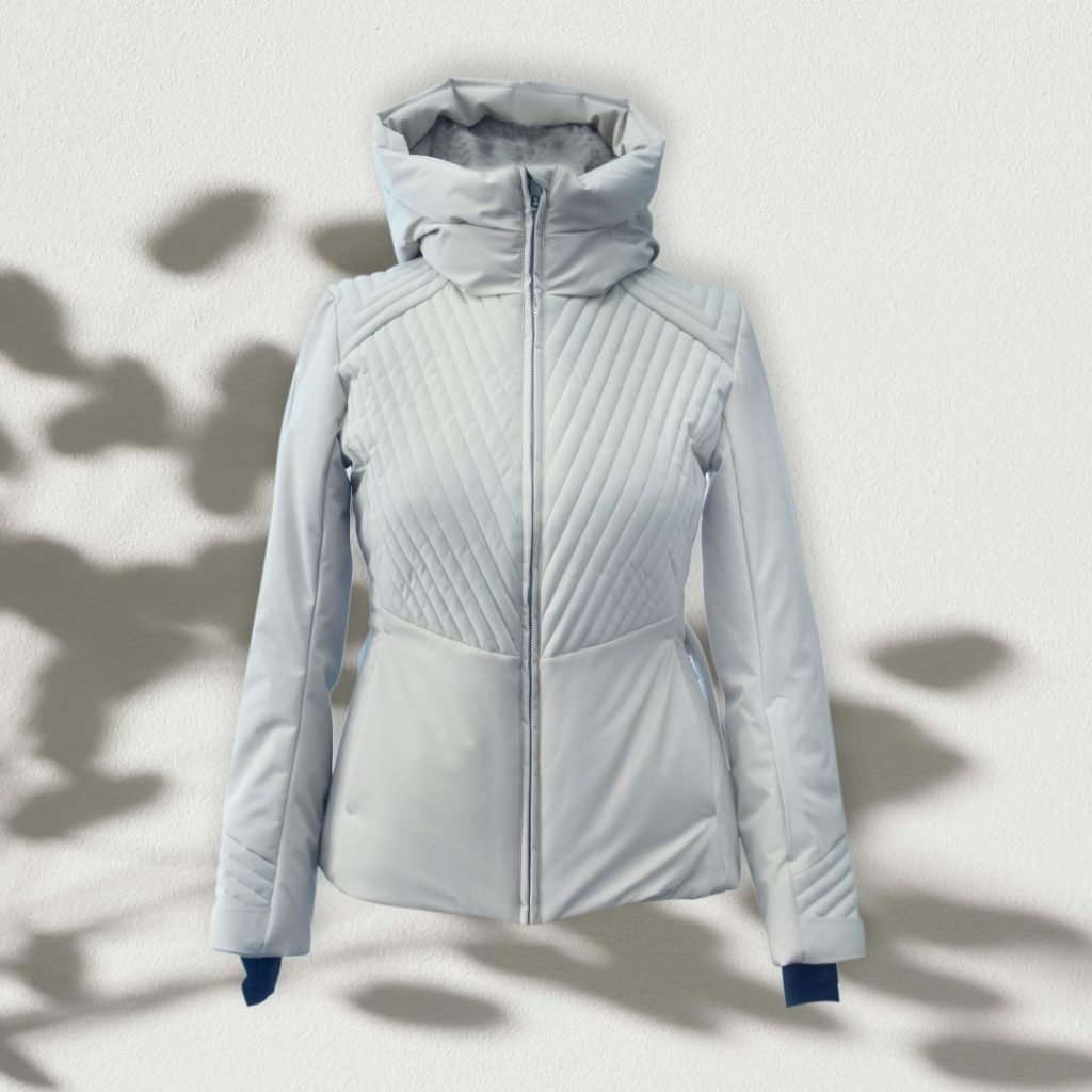 A women's quilted insulated ski jacket in white colorway.
