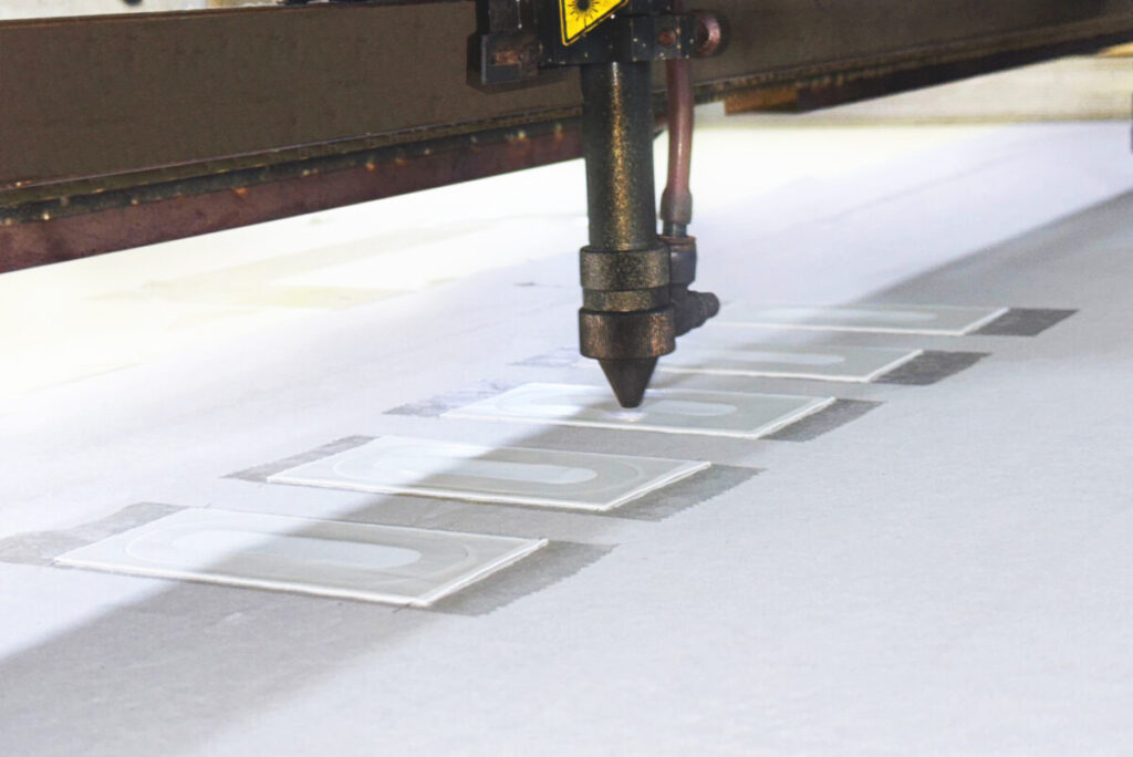 An automated laser-Cutting machine in operation at Itorch apparel's factory.