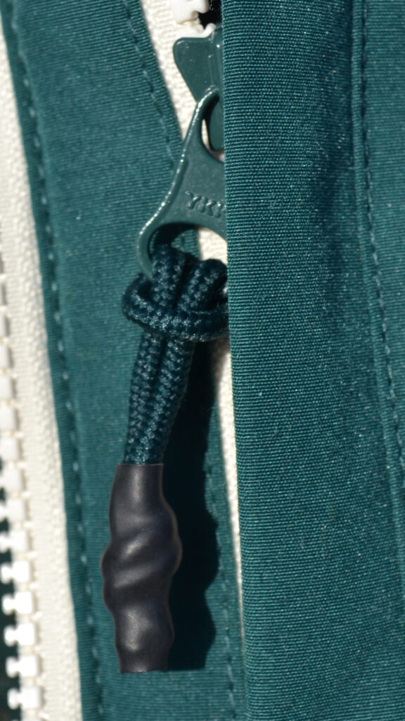Close-up of a rubber sealed zipper pull tab.