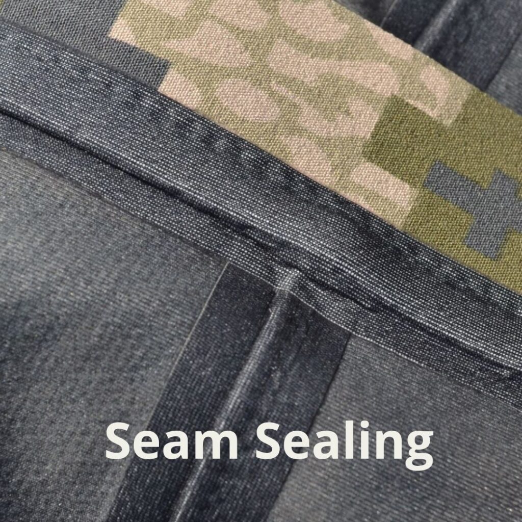 Seam sealing inside a 3L waterproof and breathable membrane jacket.